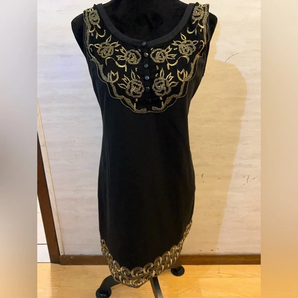 Free People sleeveless black dress with gold metallic embroidery.